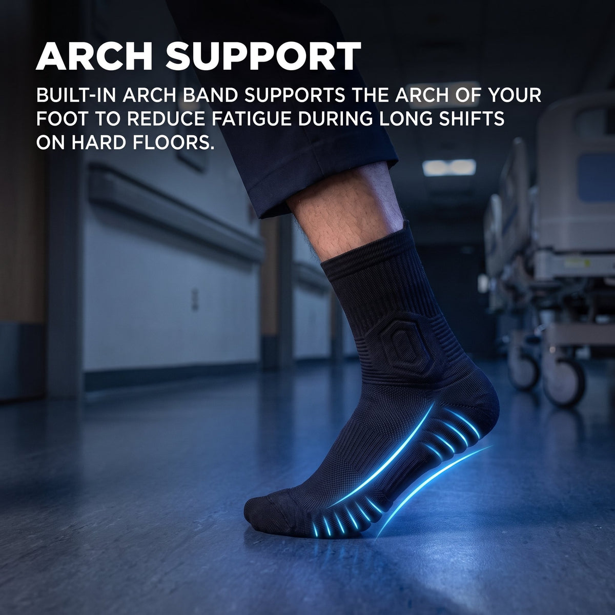 Side view of a black Shift Sock with the arch support band highlighted in blue, in a hospital corridor.