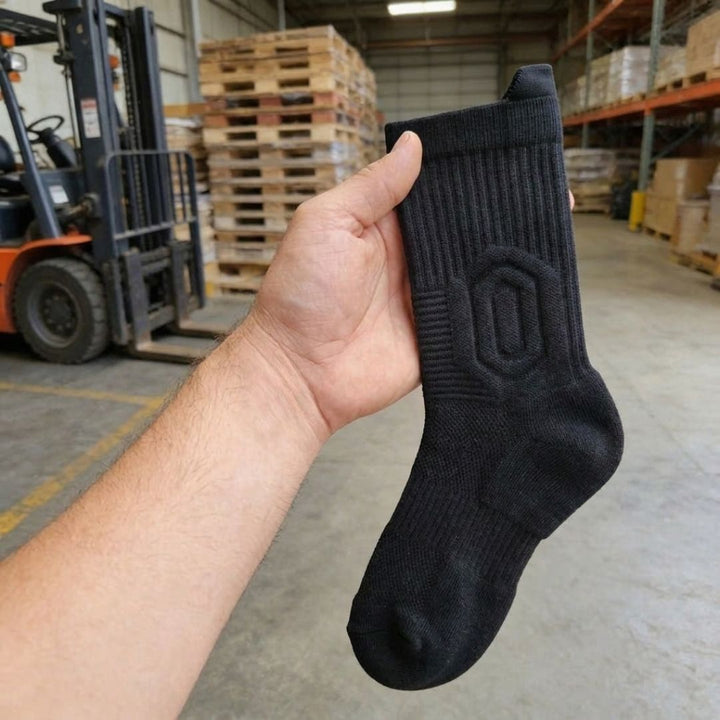 Customer photo: black sock held in hand