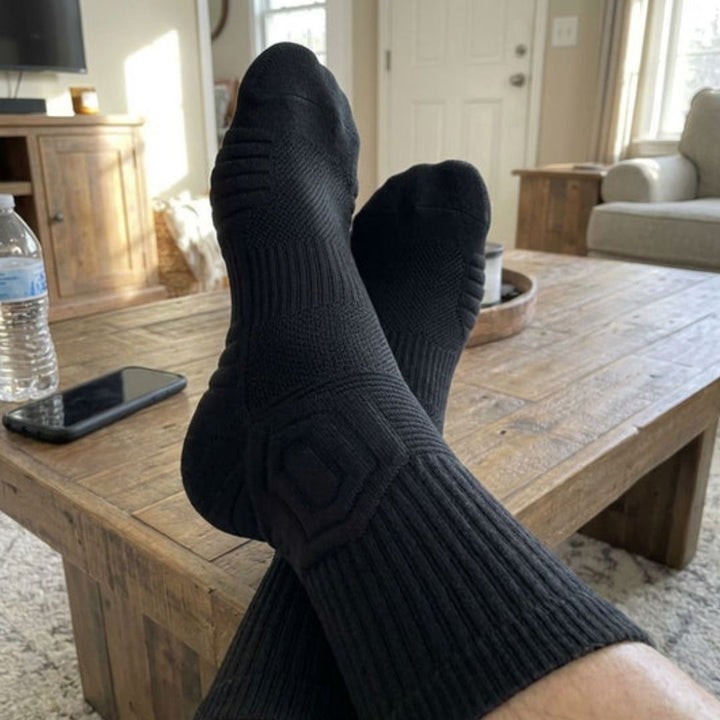 Customer photo: black socks, feet up at home